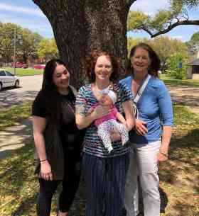 Midwife Lynneece Rooney, CNM, Doula Michelle Johnson, CLD, and client with sweet baby at their 6 week visit