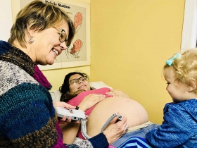Midwife Connie Blokkum, CNM during prenatal visit. Siblings are welcome to join as we listen for baby.